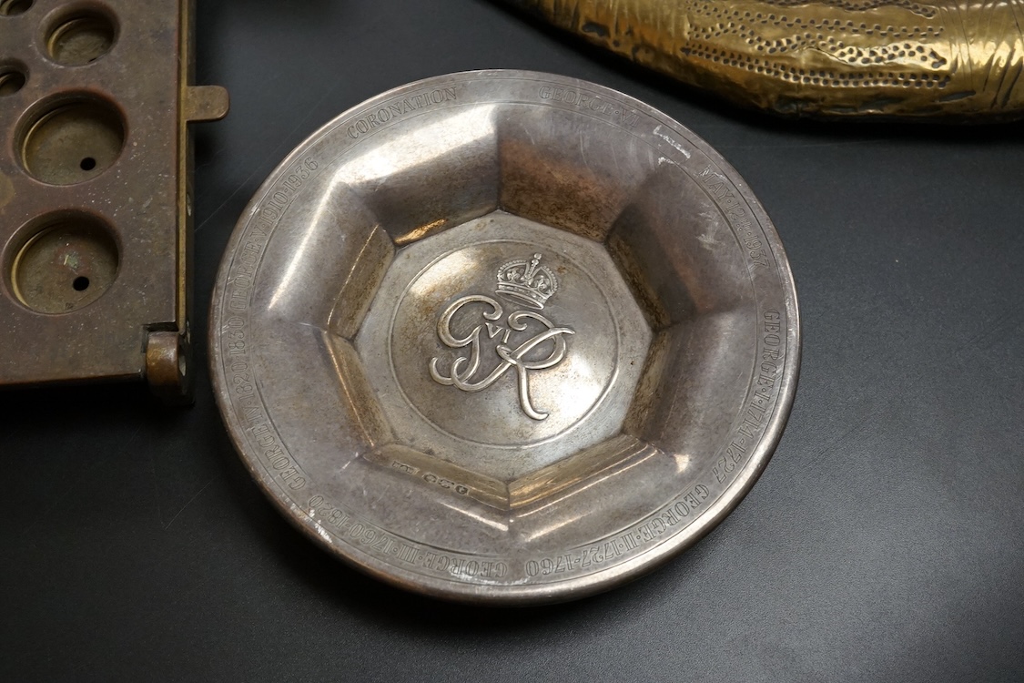 A collection of military equipment, clock, silver commemorative dish etc (6). Propeller mantel clock 41cm wide.
